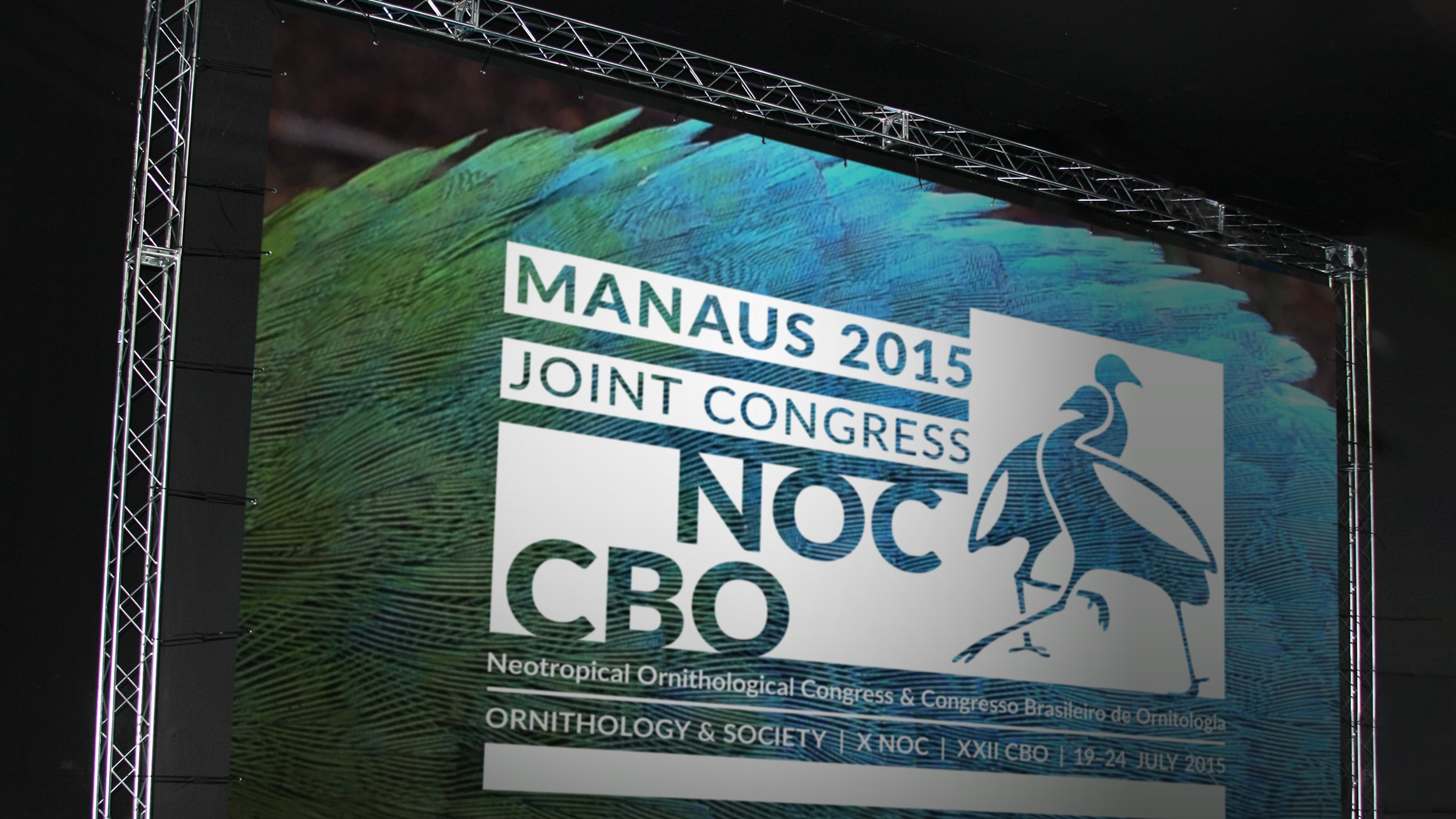 Large-scale environmental backdrop signage for stage presentations at the Manaus 2015 joint congress
